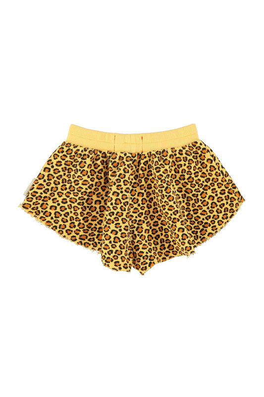 Pantalon corto mostaza con estampado animal trasera