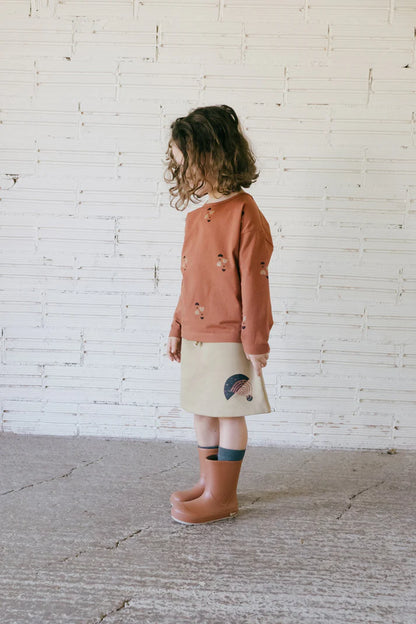Falda corta evase gaya beige detalle