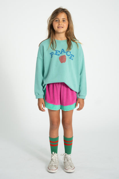 Sudadera turquesa con estampado peace conjunto delantera 1