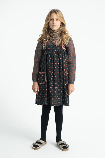 Parte trasera de vestido de niña negro con flores de piupiuchick.