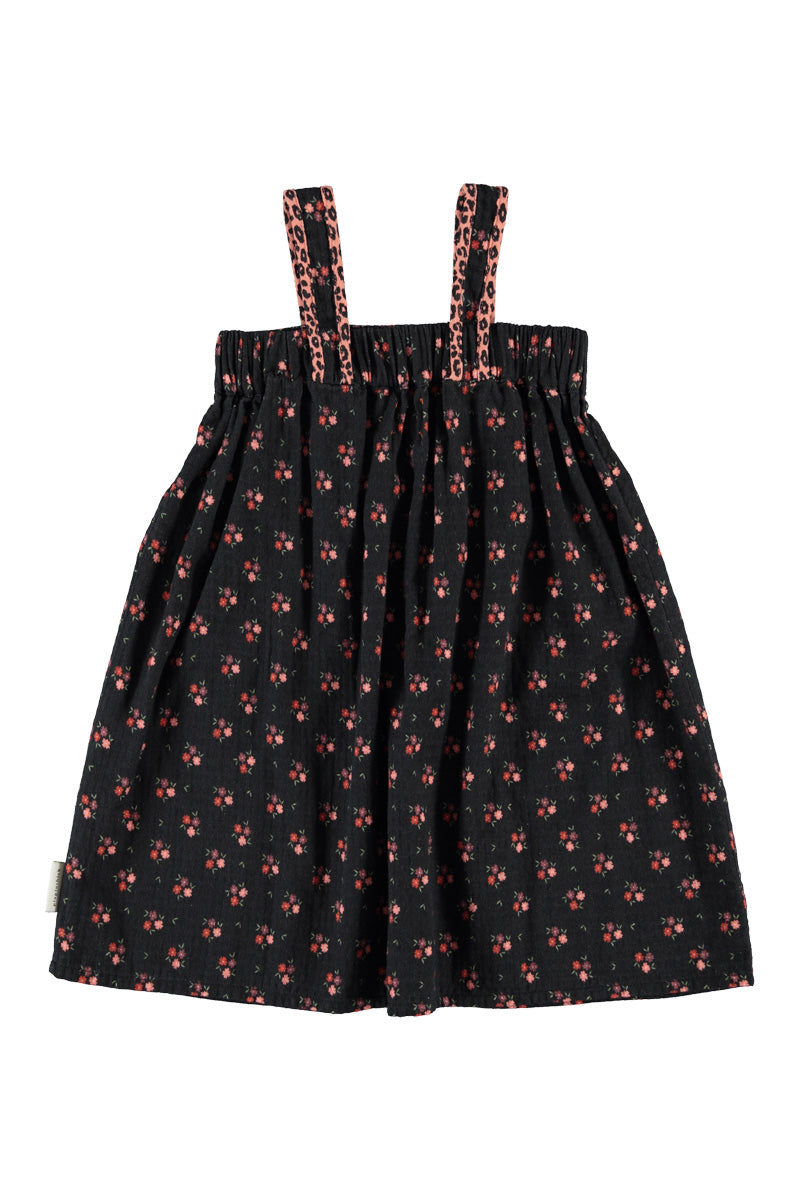 Detalle de vestido de niña negro con flores de piupiuchick.