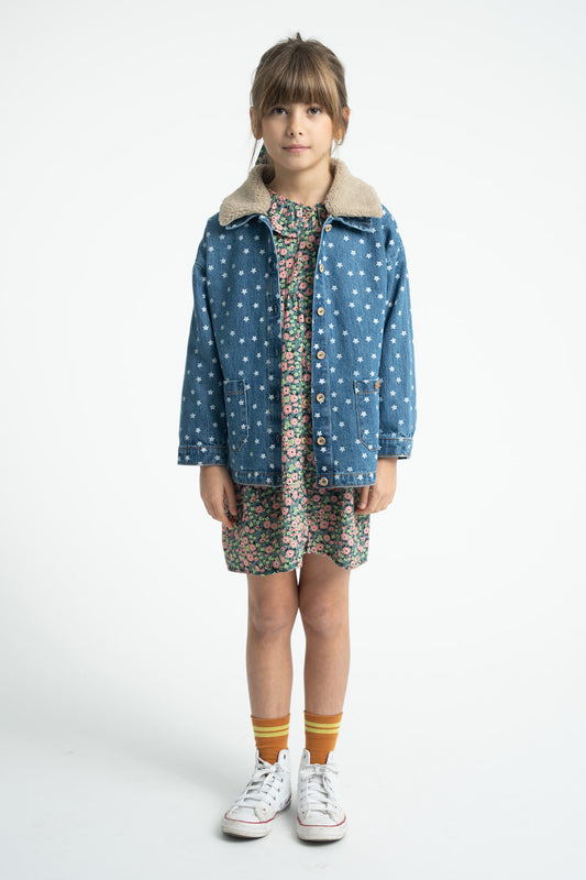 Parte trasera de vestido de niña verde con flores multicolor de piupiuchick.