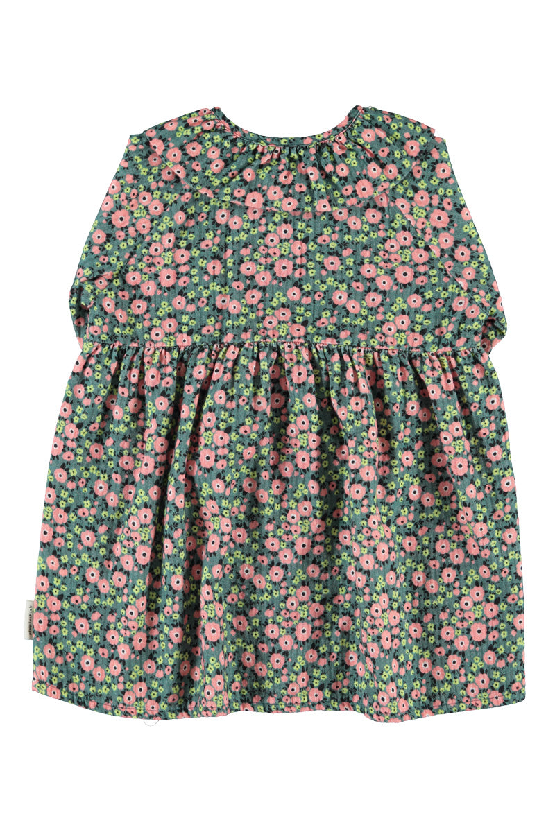 Detalle de vestido de niña verde con flores multicolor de piupiuchick.