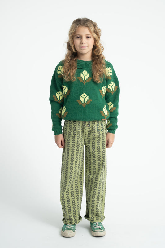 Parte trasera de jersey de niña verde con flores de piupiuchick.
