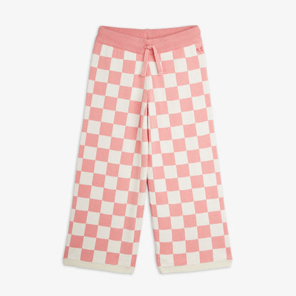Pantalón de niña rosa cuadros ajedrez, vista frontal.