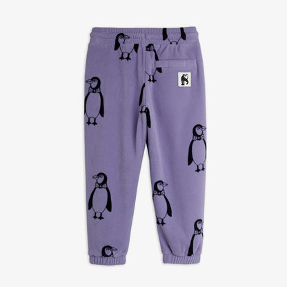 Parte trasera del pantalón de niño púrpura pingüinos.