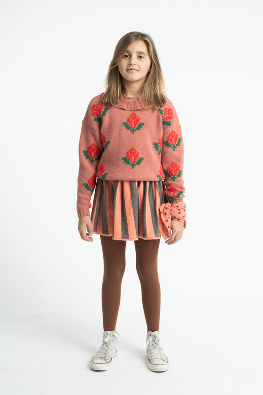 Parte trasera de falda de niña rosa y verde con rayas de piupiuchick.