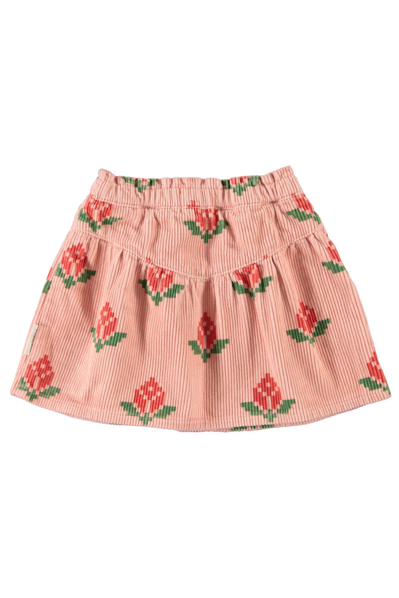 Detalle de falda de niña rosa con flores grandes de piupiuchick.