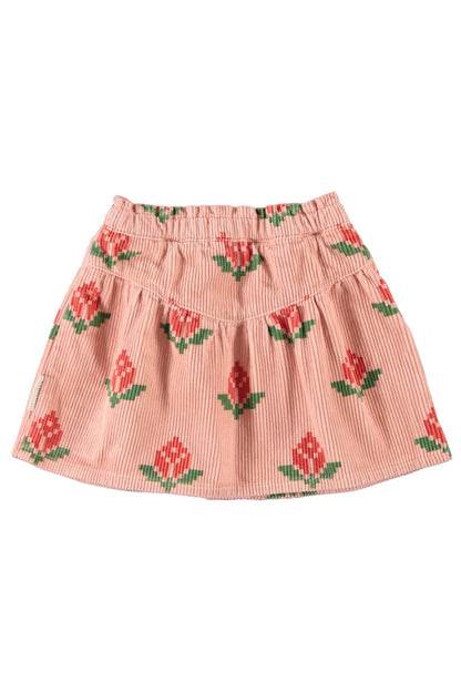 Detalle de falda de niña rosa con flores grandes de piupiuchick.