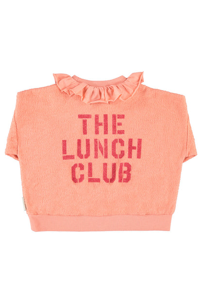 Detalle de sudadera de niña rosa con manzana de piupiuchick.