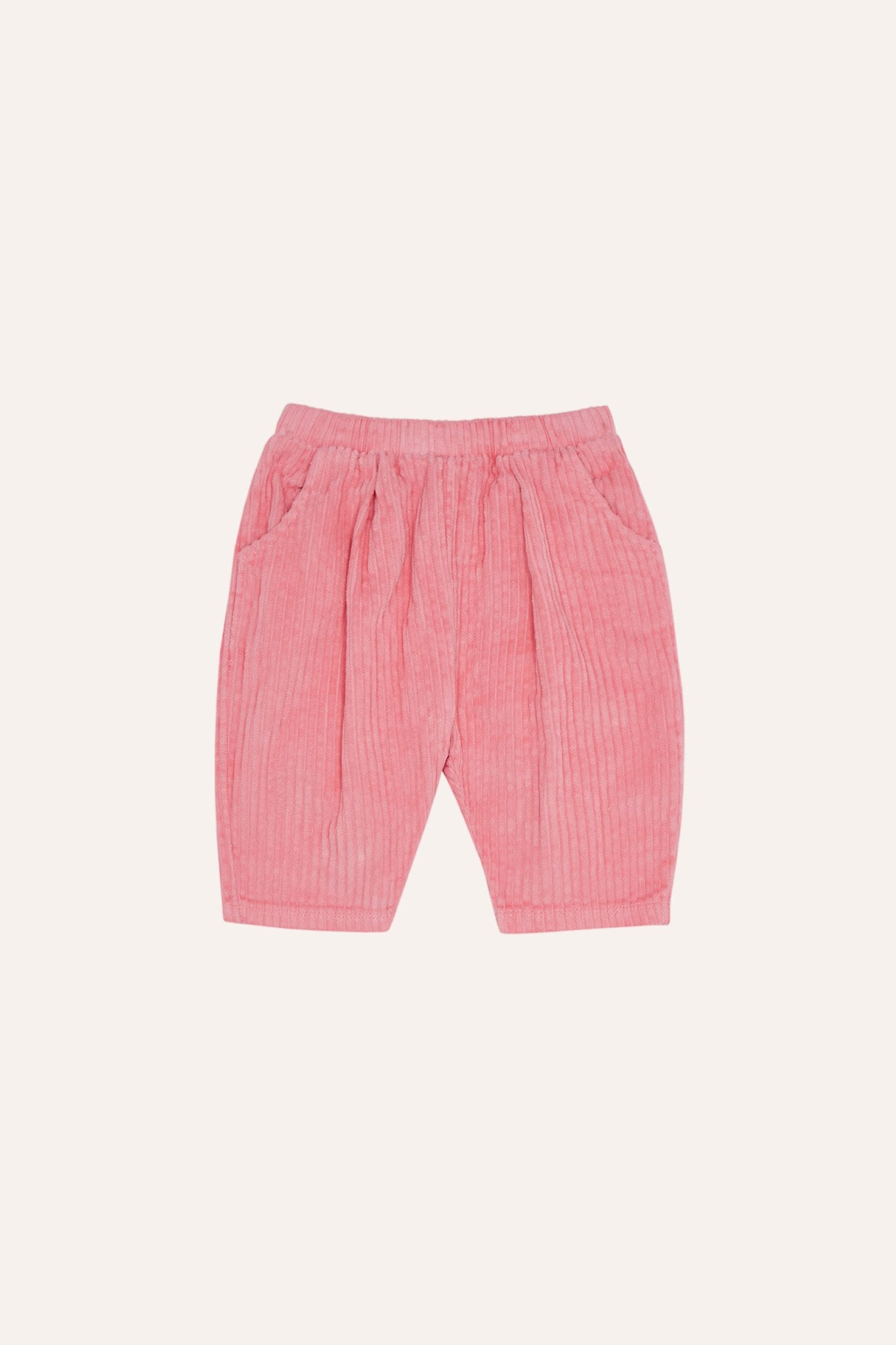 Pantalón de bebé rosa de pana con cintura elástica, vista frontal.