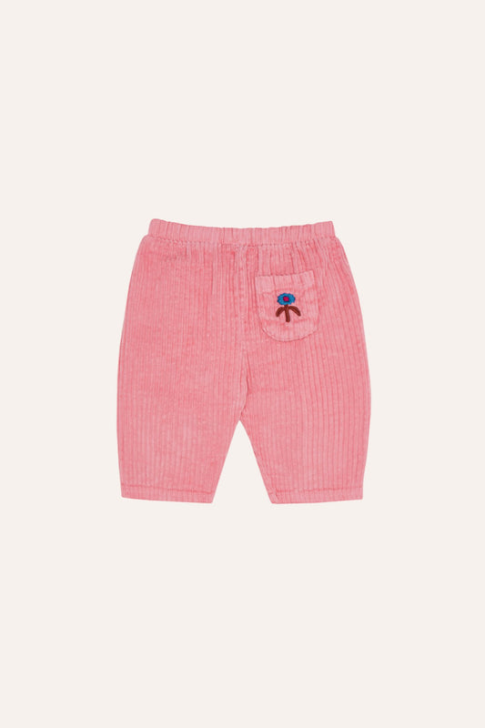 Pantalón de bebé rosa de pana con bordado trasero.