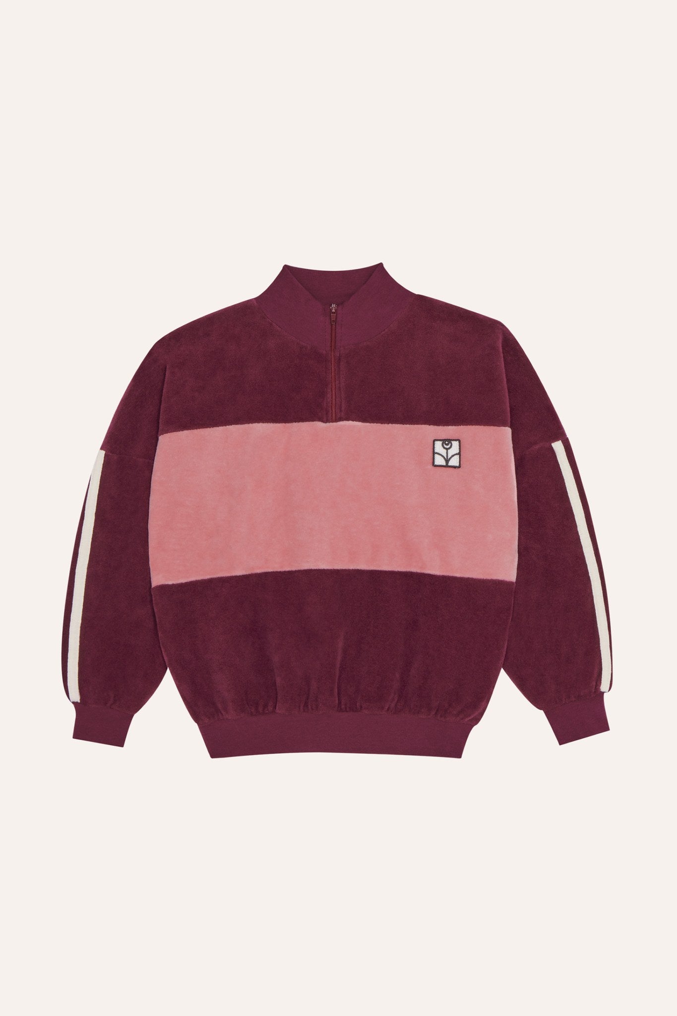 Sudadera de terciopelo burdeos y rosa con cuello alto, vista frontal.