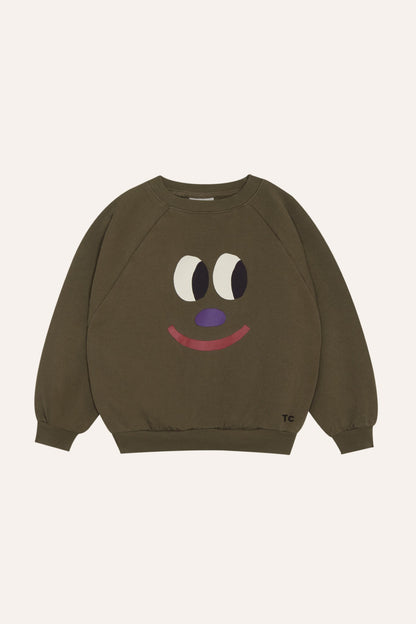 Sudadera infantil marrón con cara sonriente, vista frontal.