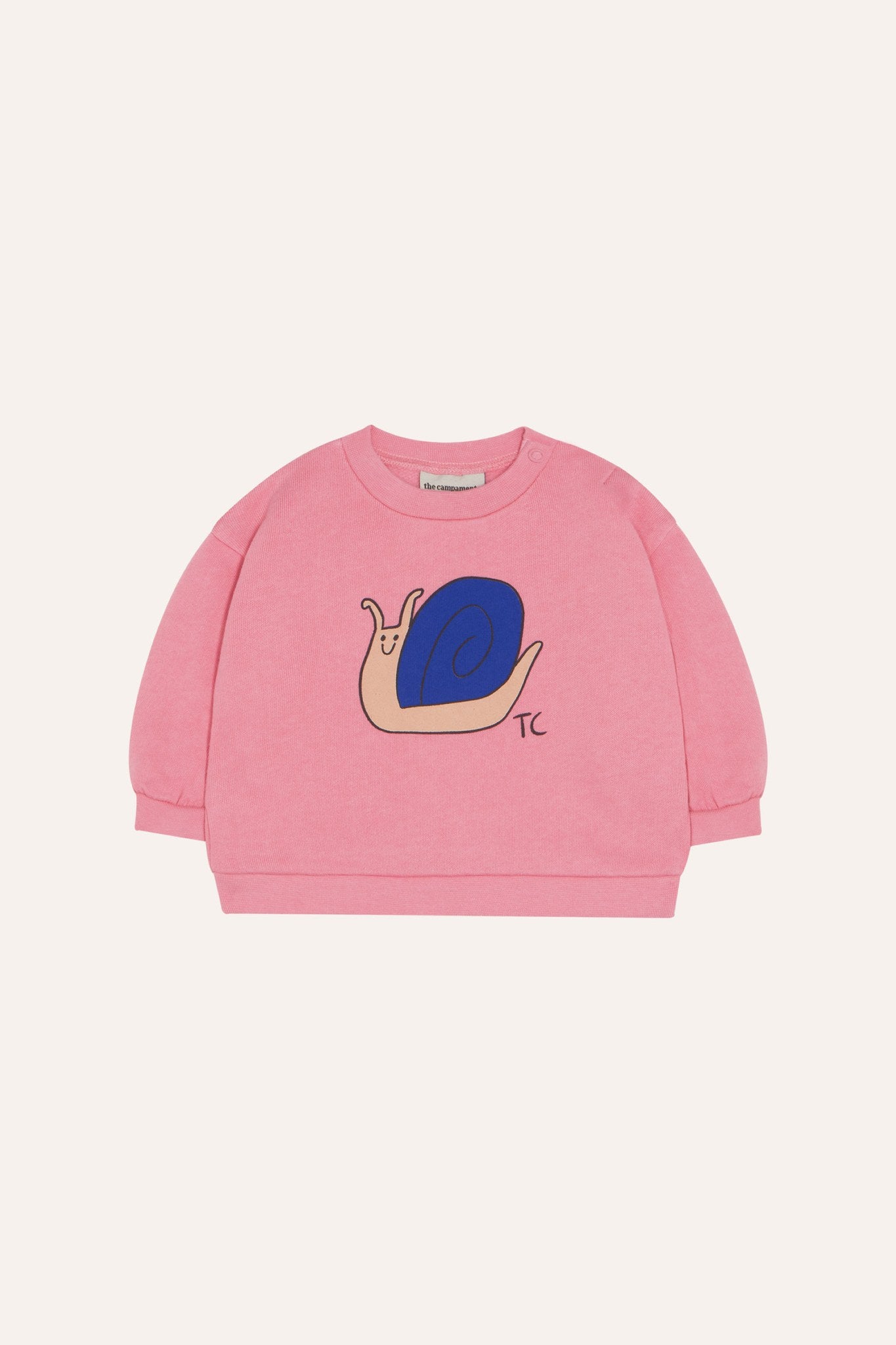 Sudadera de bebé rosa con caracol azul, vista frontal.