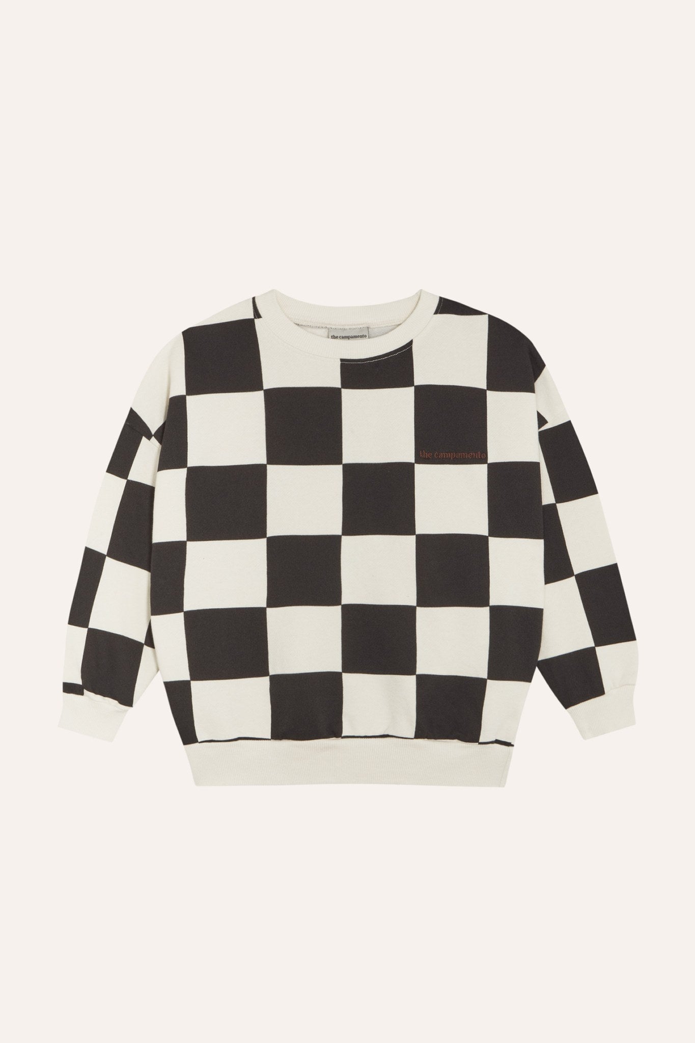 Sudadera infantil de cuadros negros y crudos, vista frontal.