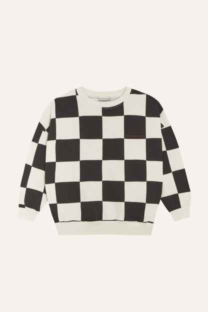 Sudadera infantil de cuadros negros y crudos, vista frontal.