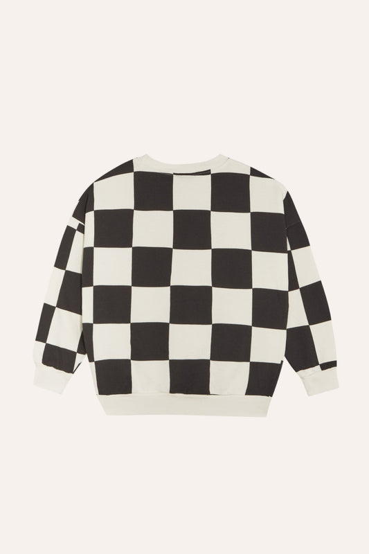 Sudadera de cuadros negros y crudos, vista trasera.