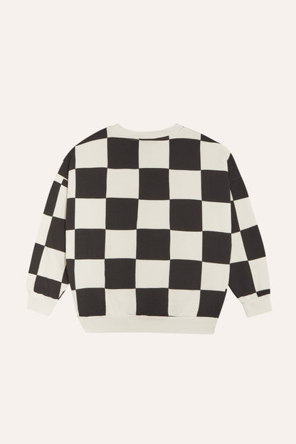 Sudadera de cuadros negros y crudos, vista trasera.