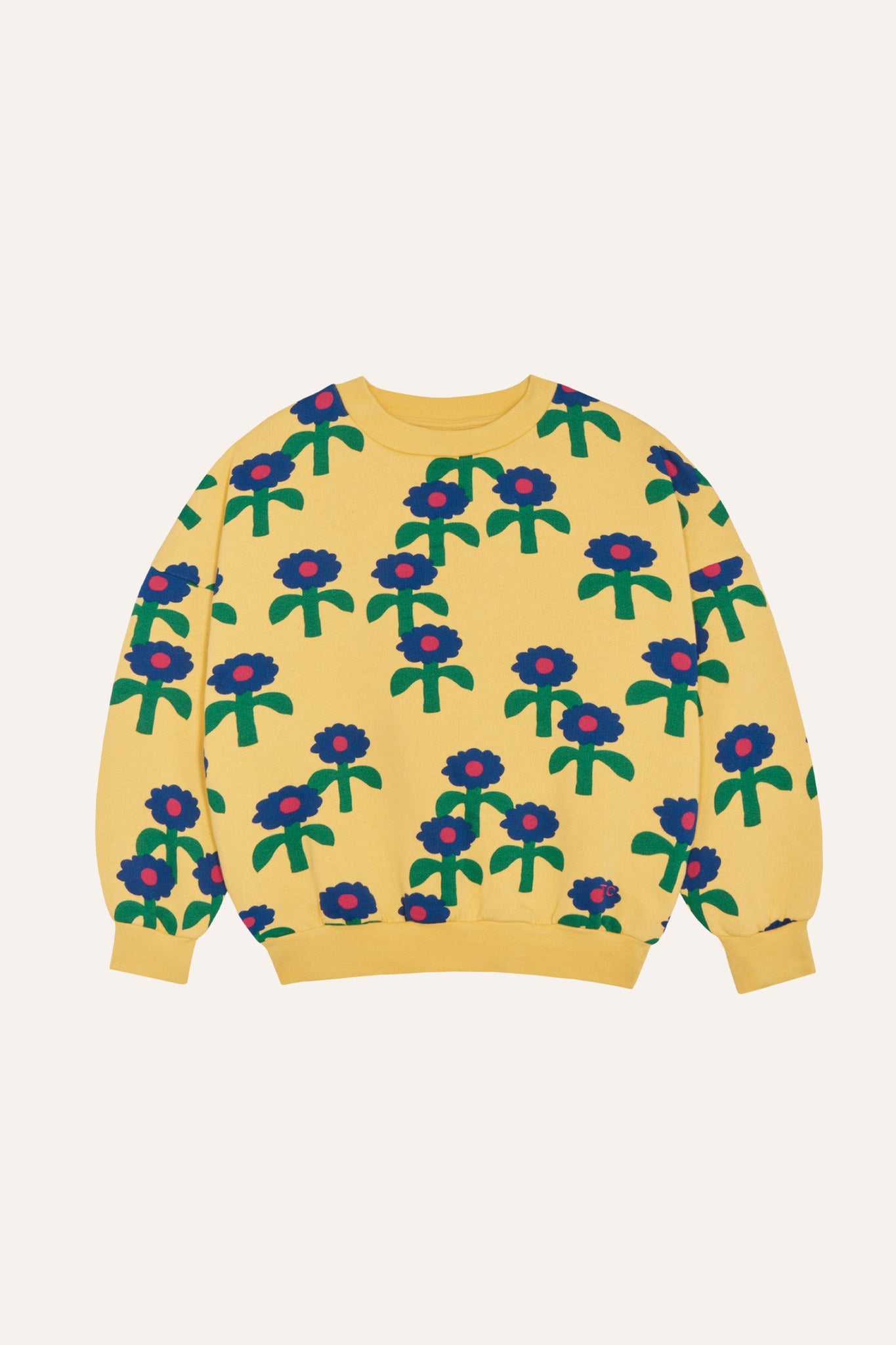 Sudadera infantil amarilla con margaritas azules, vista frontal.