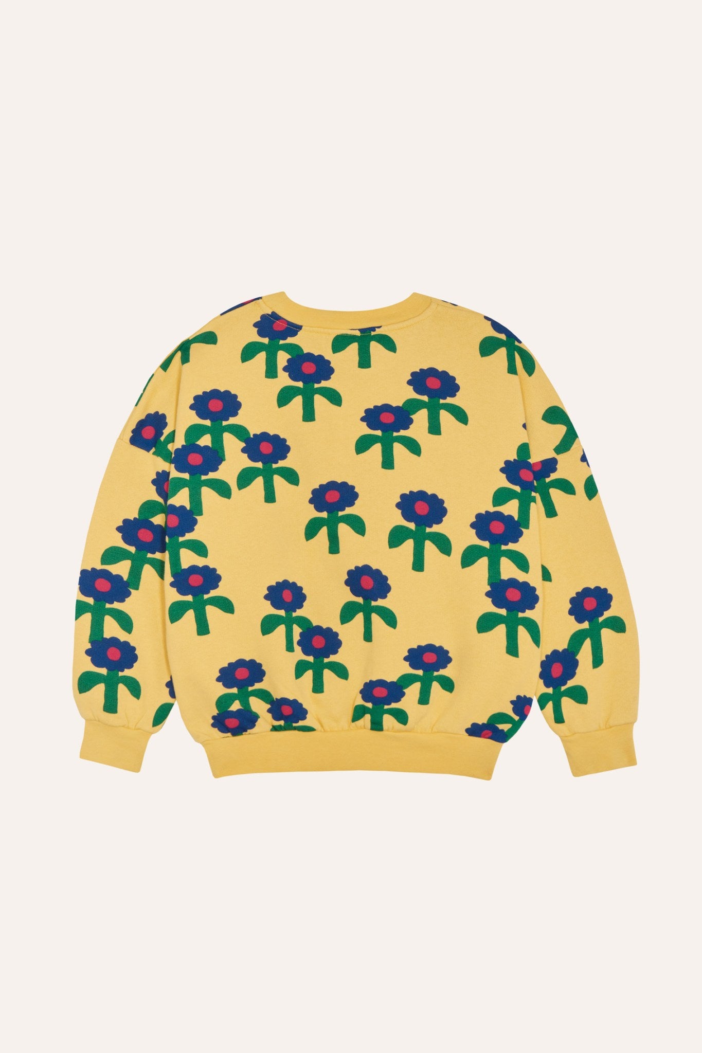 Sudadera amarilla con margaritas azules, vista trasera.